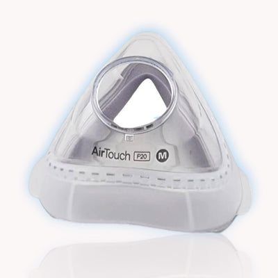 A ResMed AirTouch F20 memory foam cushion for full face CPAP masks, displayed in a clear, well-lit image showing its shape and hole for the nose.